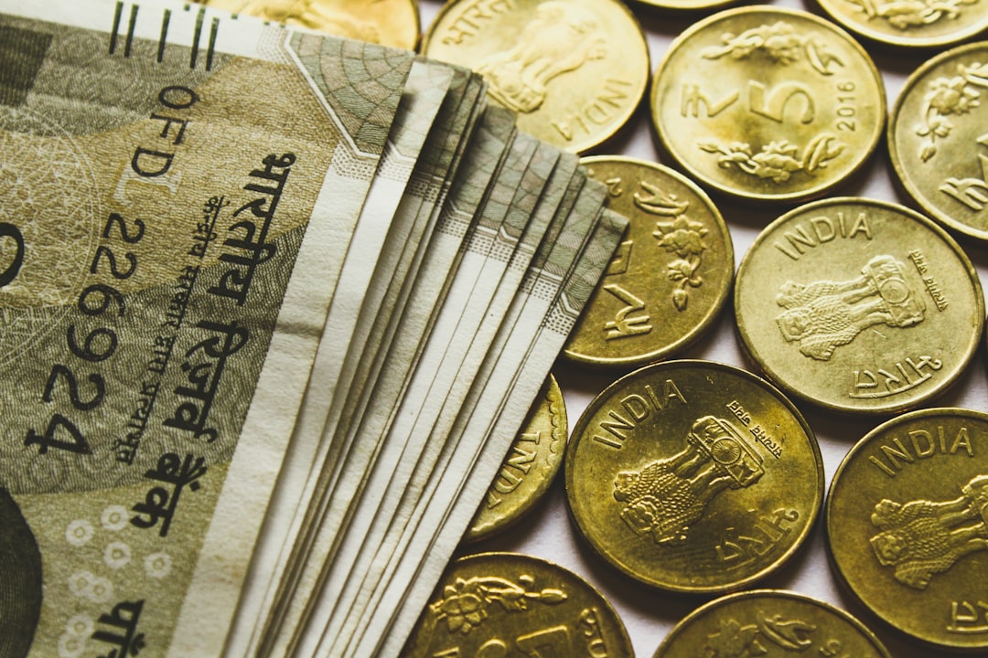services-01 round-gold-colored-rupee-coins-and-banknotes-kzuii7enbws