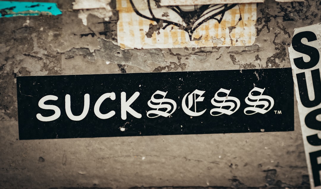 services-01 a-black-and-white-street-sign-on-a-wall-syqkrv5smre